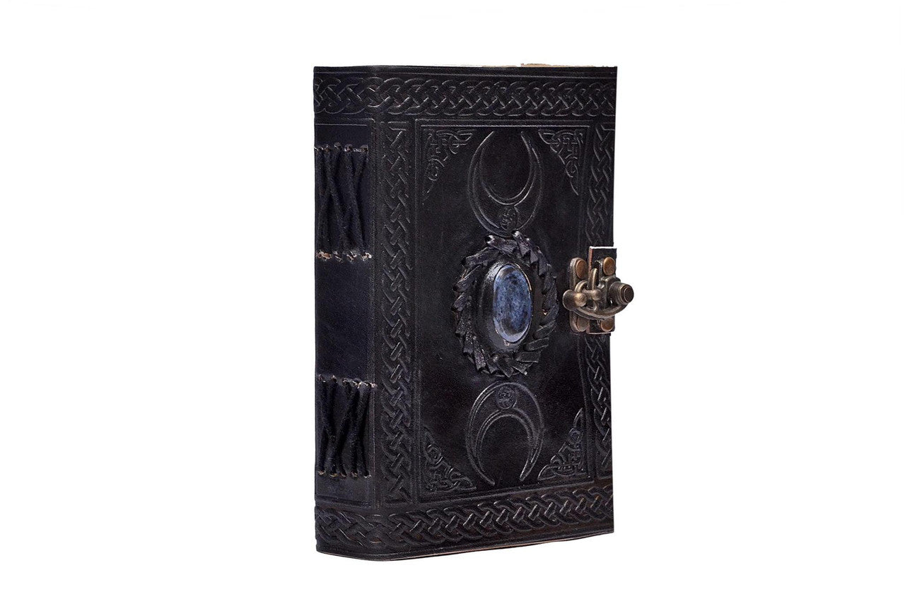 300 Moon Blue Lapiz Embossed Journal with black leather cover, blue gem accent, and metal clasp.