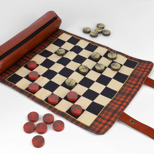 Pendleton Red Black Check Pattern Chess & Checkers set unrolled with red and yellow pieces on and next to the board.
