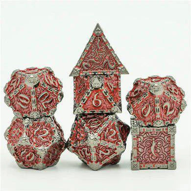 Four Dagger of Venom: Nightmetal and Garnet RPG metal dice stacked together.
