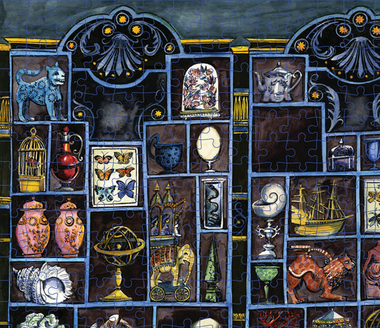 Murder Most Puzzling 500-piece puzzle featuring a collector’s death scene with antiques and curios.