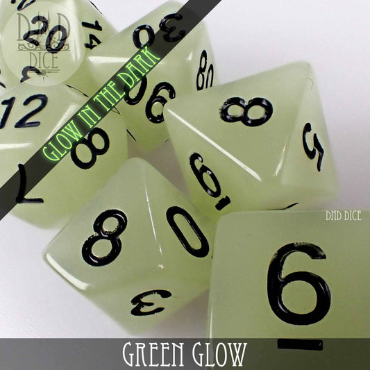 Green Glow in the Dark acrylic D&D dice set with black numbers, close-up view.