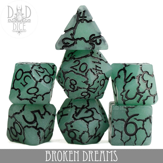Broken Dreams resin 7-dice set in green and black colors.