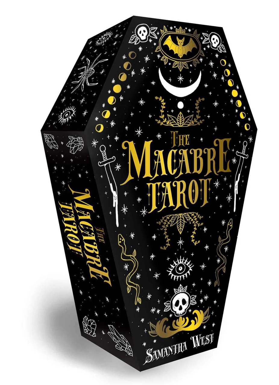 The Macabre Tarot 78-Card Deck & Book in a coffin-shaped box with gold and white symbols and skulls.