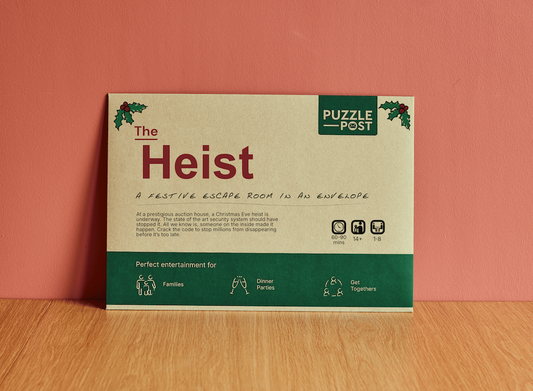 Envelope labeled Escape Room | Puzzle Game | Board Game | The Heist.
