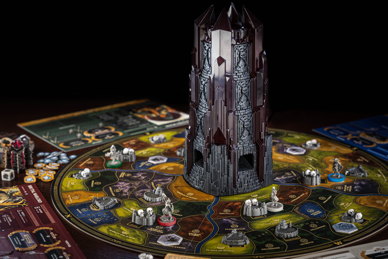 Return to Dark Tower cooperative board game with large dark tower and colorful hero and monster miniatures.