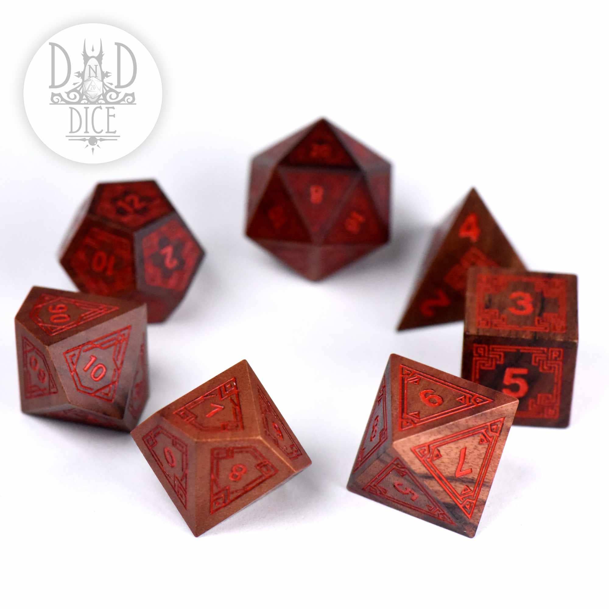 Seven-piece Guibourtia wood dice set, Interlinked - Wood (Gift Box) variant; DnD Dice logo in corner.