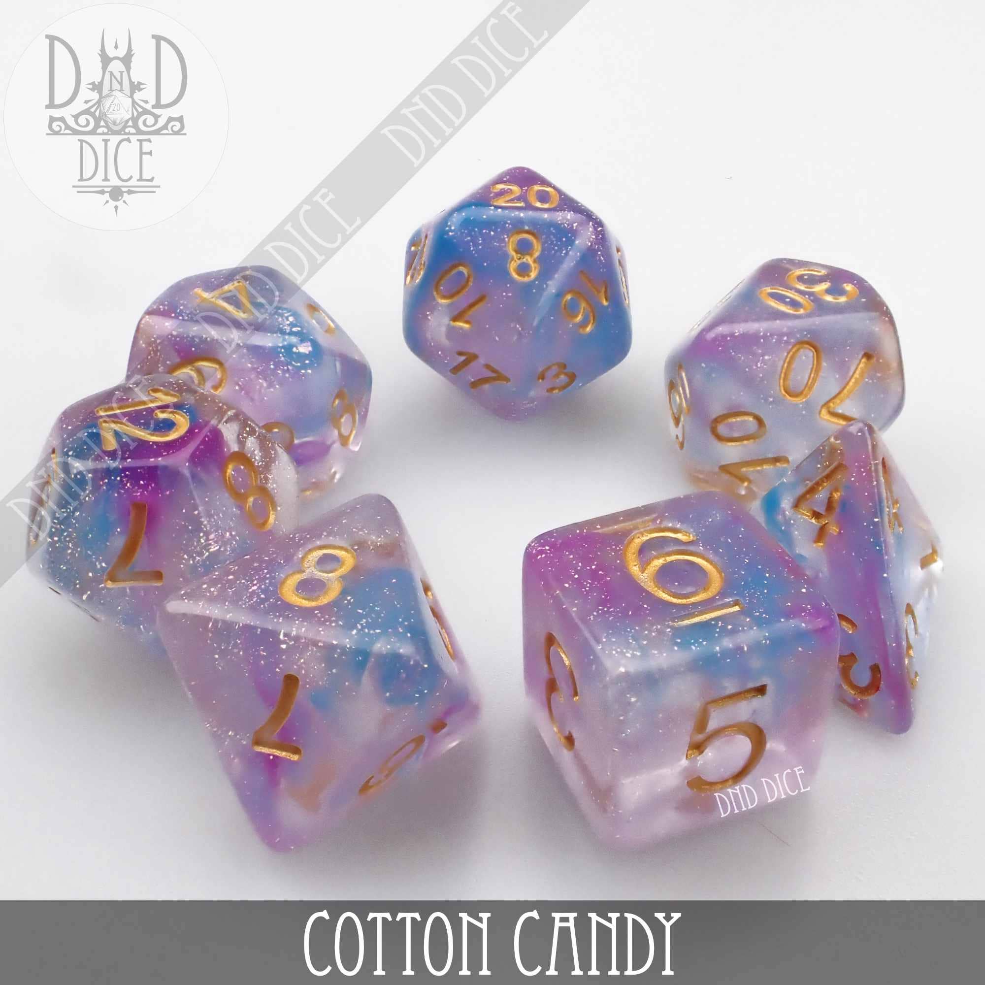 Cotton Candy 7-dice set in glittery purple, blue, and pink resin with gold numbers for tabletop gaming.