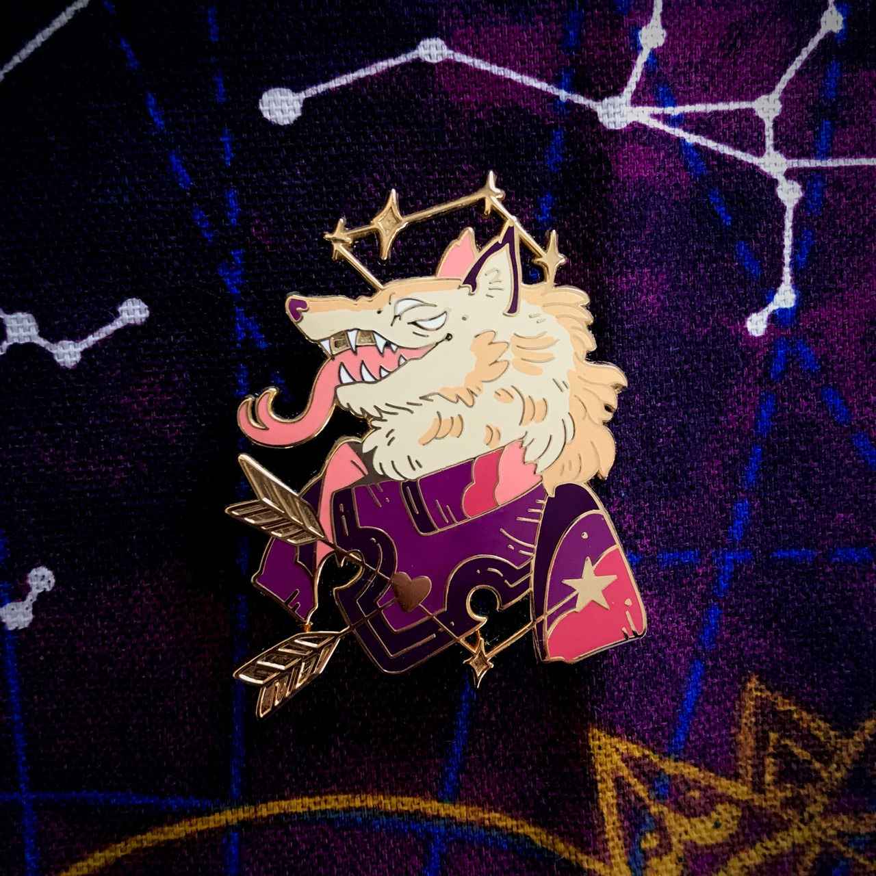 Wolf Knight Pin showing a wolf in a purple robe with gold stars, holding arrows, wearing a crown, on a star map background.