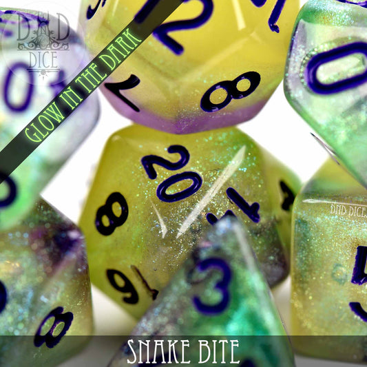 Snake Bite Glow in the Dark dice set with purple numbers and glitter.