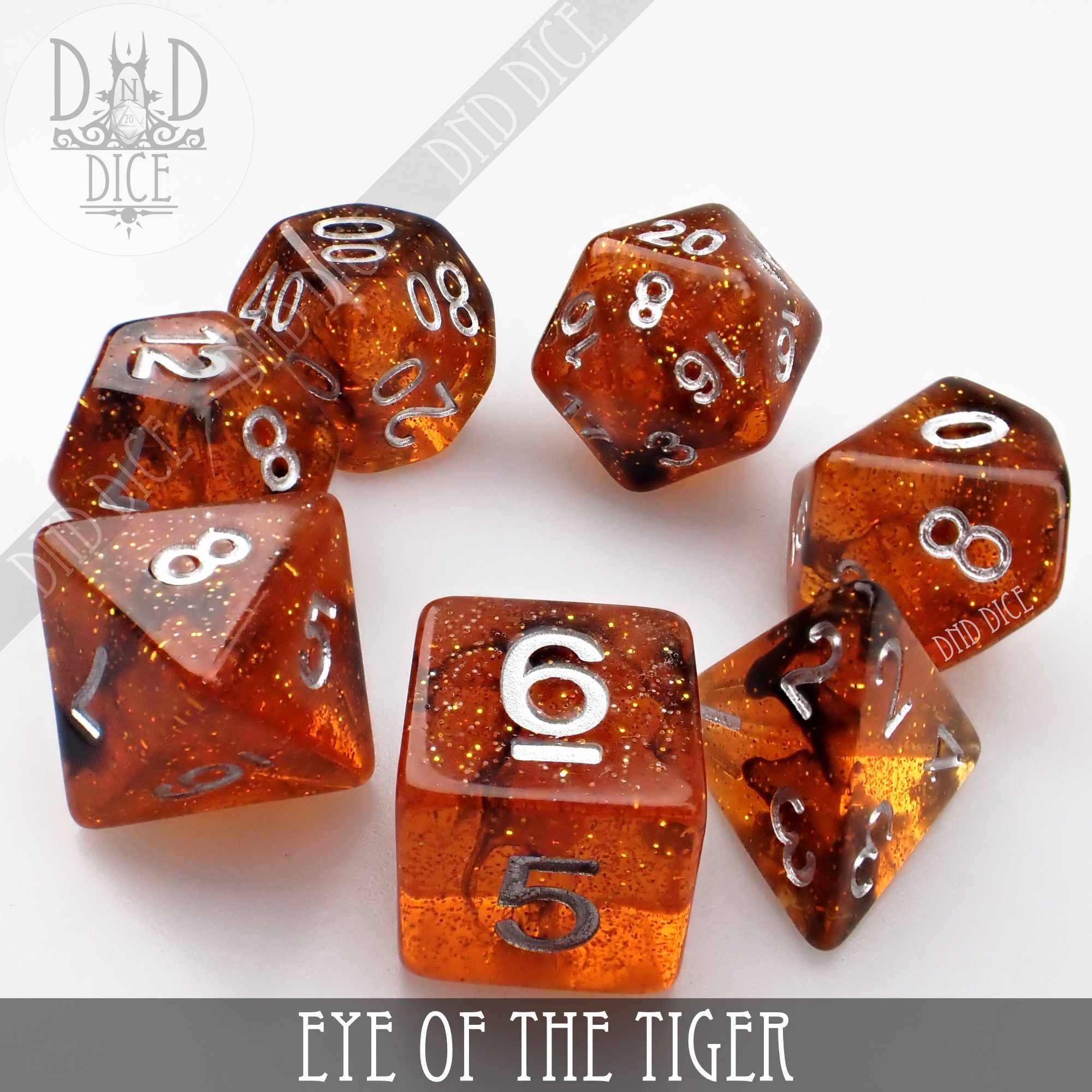 Eye of the Tiger set of 7 translucent orange resin dice with silver numbers for DND games.