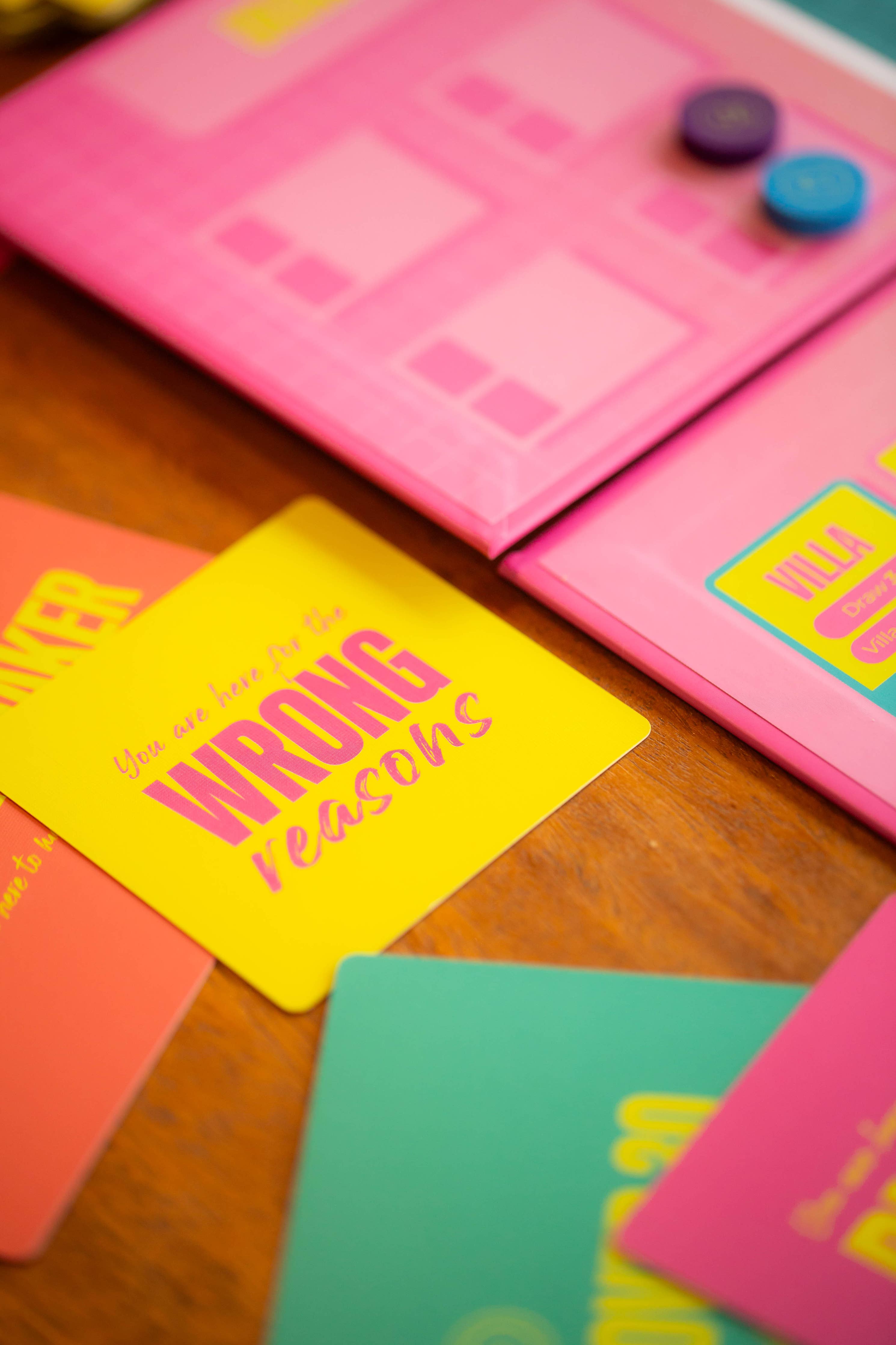 Lovestruck game cards on a table, with one card showing the text You are here for the WRONG reasons.