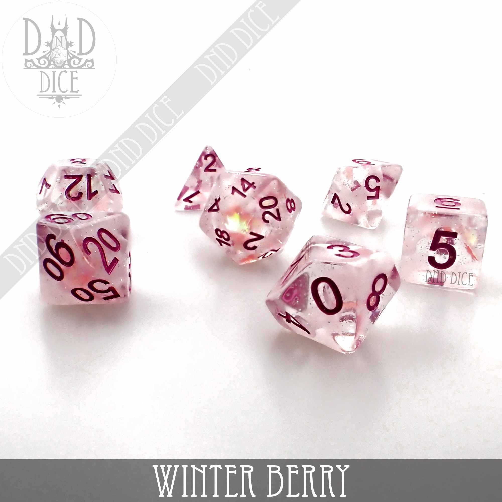 Winter Berry translucent pink resin dice set with red numbers.