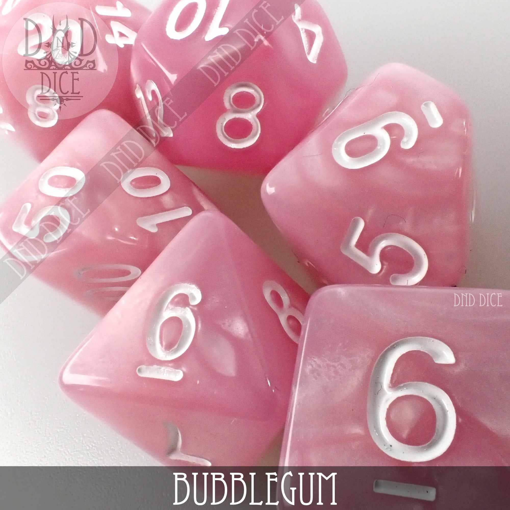 Pink acrylic Bubblegum role playing dice on a white background with Bubblegum text at the bottom.