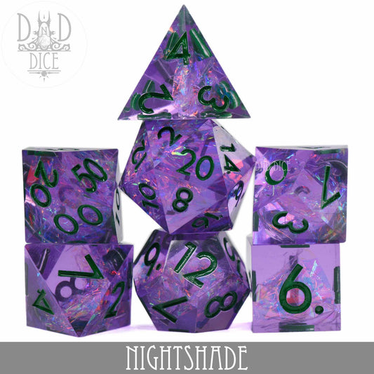 Nightshade Handmade purple iridescent resin dice with green numbers, label visible at the bottom.