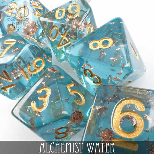 Alchemist Water 7-dice set in blue resin with gold numbers and metallic flakes.