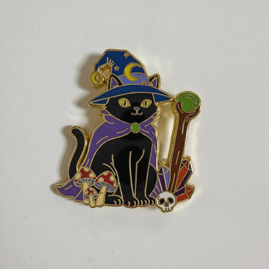 Mage Cat Pin (Gold Variant): black cat in wizard hat and purple cape, with mushrooms, crystals, and a skull.