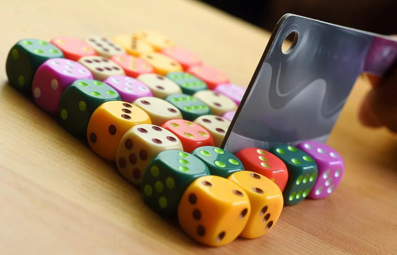 Diced Veggies board game with a hand holding a cleaver over colorful dice.