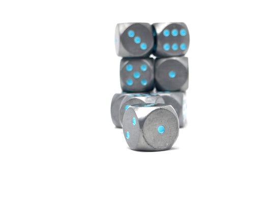 Six Warpips: Spellbound 10-12mm metal D6 dice with blue pips, stacked on a white surface, one die in front.