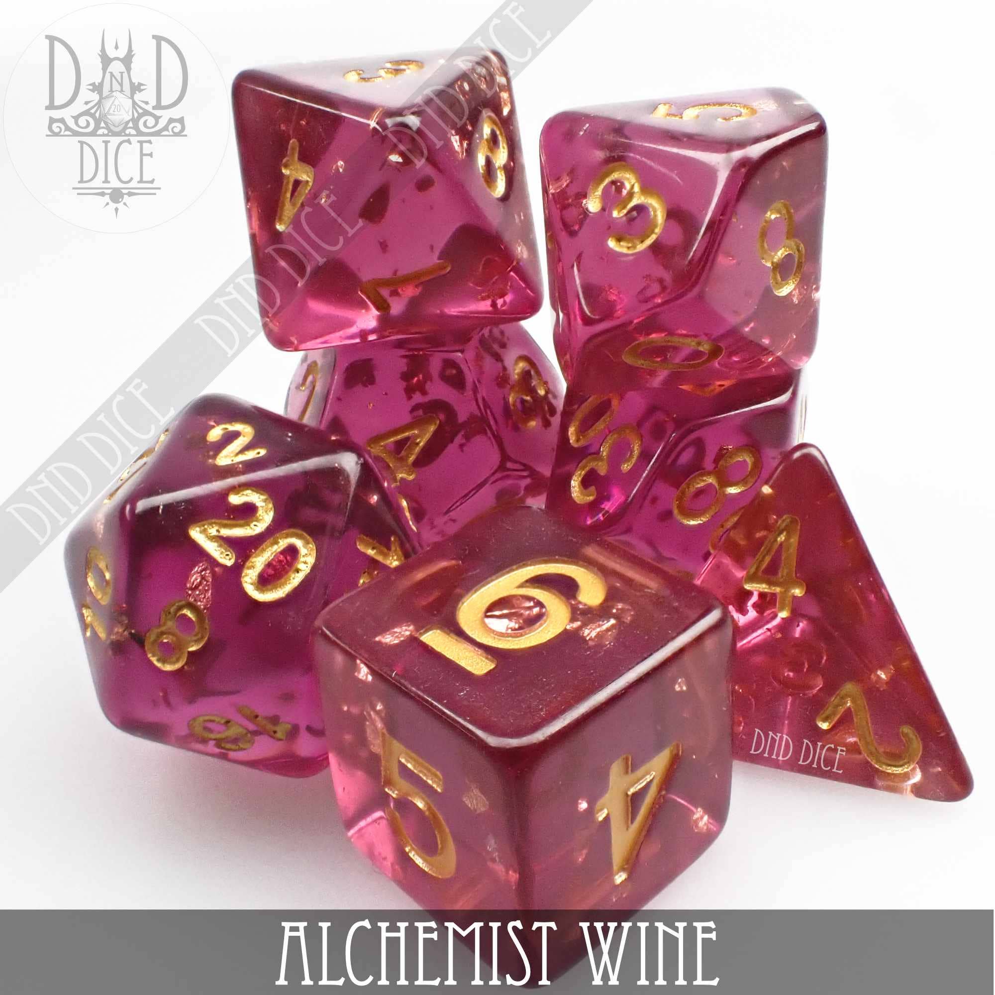 Alchemist Wine 7-piece translucent pink resin dice set with gold numbers.