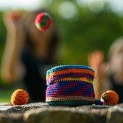 Canastaball (YippiYappa) colorful woven pouch containing yarn balls.