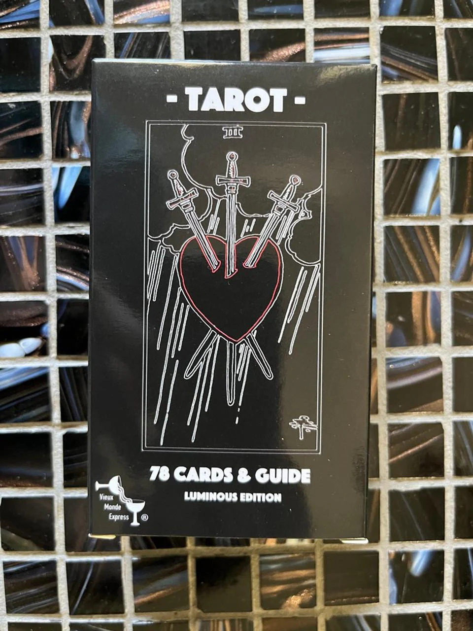 The Luminous Tarot Classic 1909 Smith Rider Deck and 100-page guidebook with heart and three swords box art.