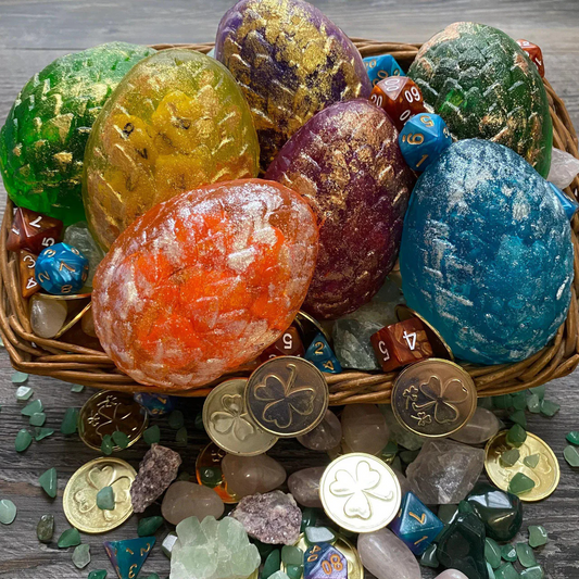 Yellow Dragon Egg Dice Soap with dice soap, coins, and crystals on a wooden surface.
