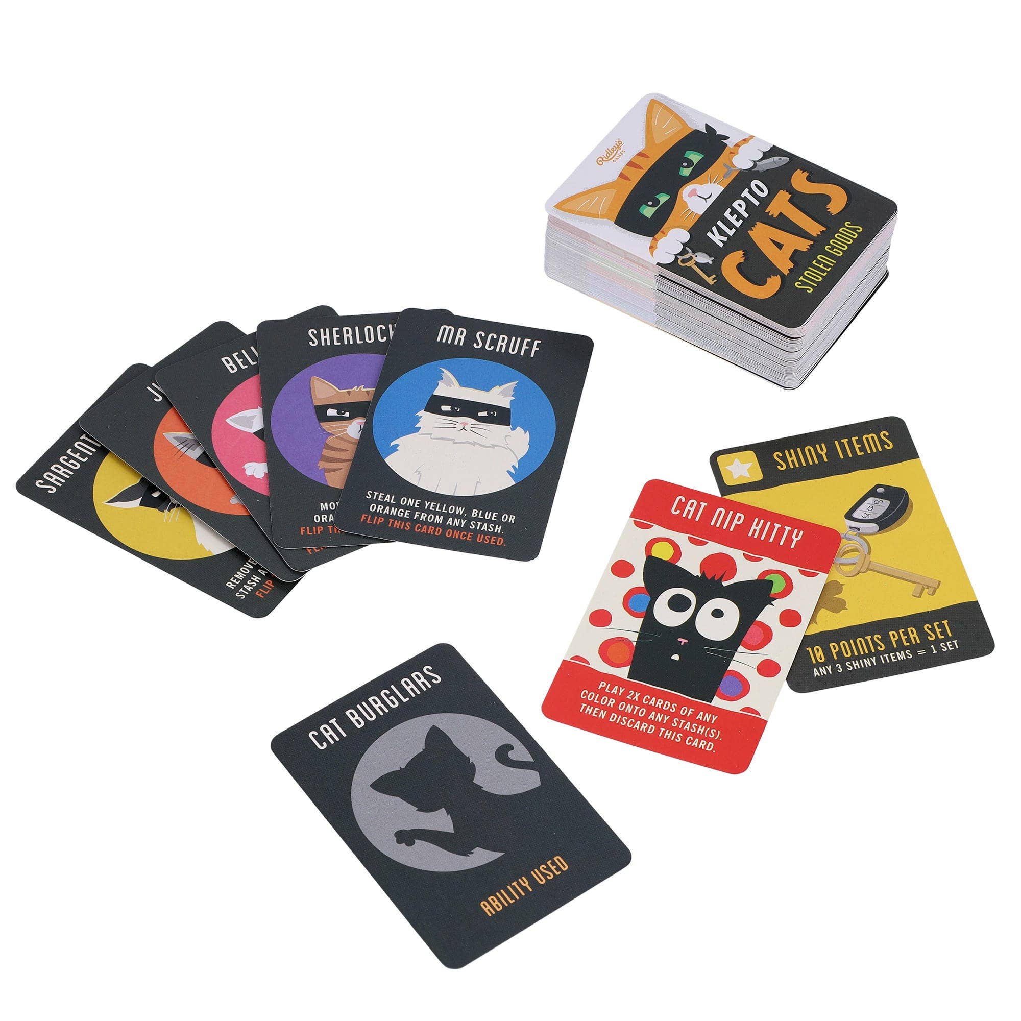 Klepto Cats card game cards displayed on a white surface, featuring illustrated card designs.