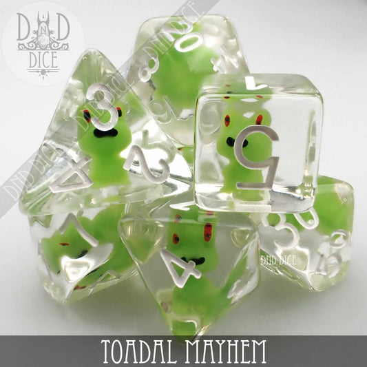 Toadal Mayhem 7-dice set made of clear resin with green frogs inside and white numbers.