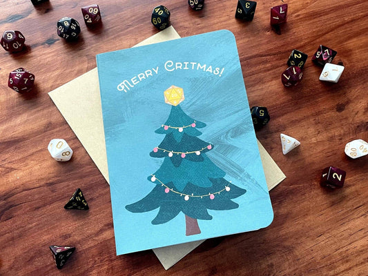 Merry Critmas Holiday Card with a dice-themed tree, polyhedral dice, and the message “Merry Critmas”.
