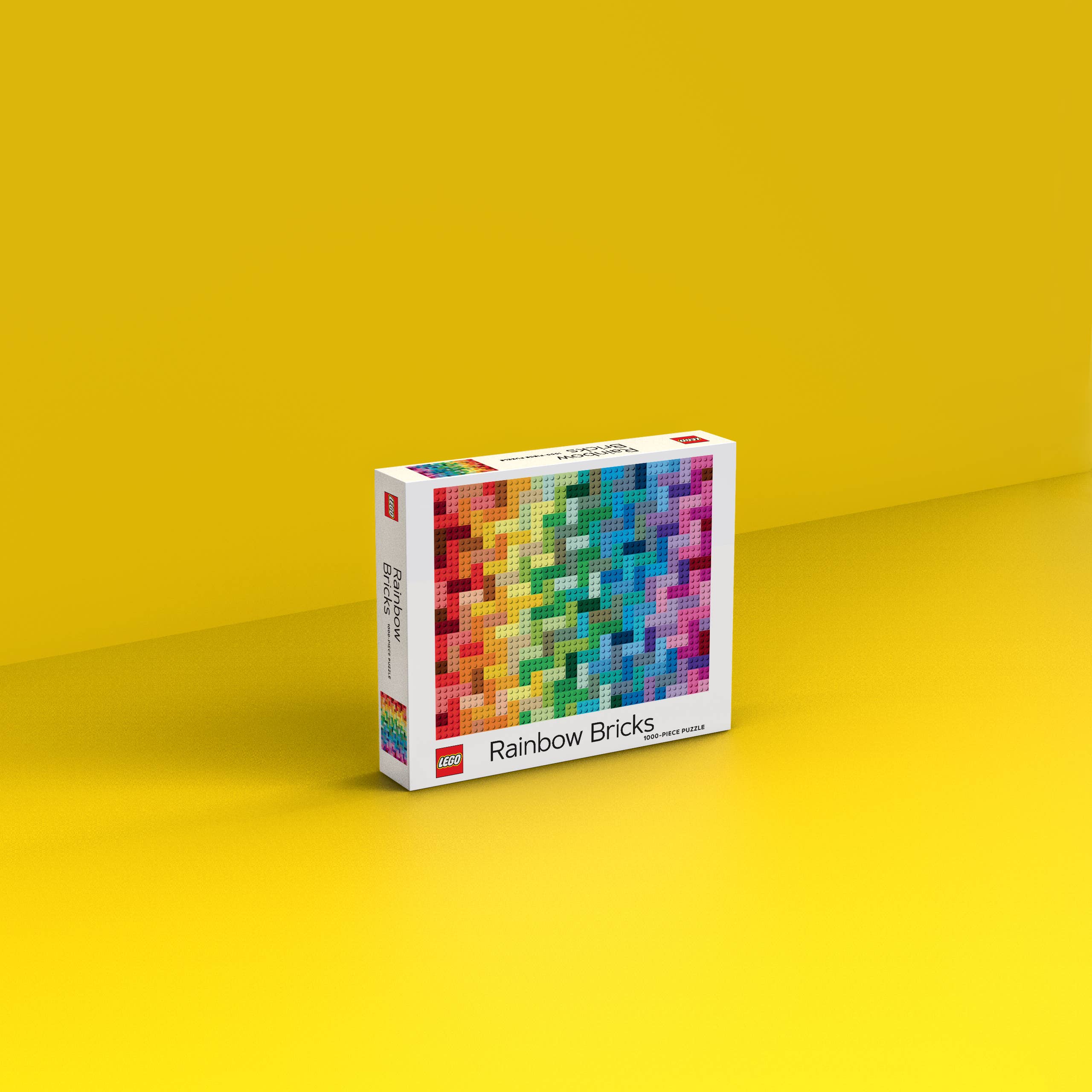 LEGO Rainbow Bricks Puzzle box on a yellow surface.
