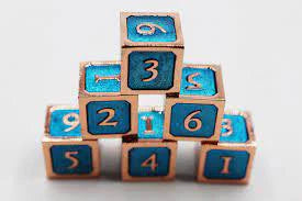 Seven Blue and Copper D6 Metal Dice arranged in a pyramid.