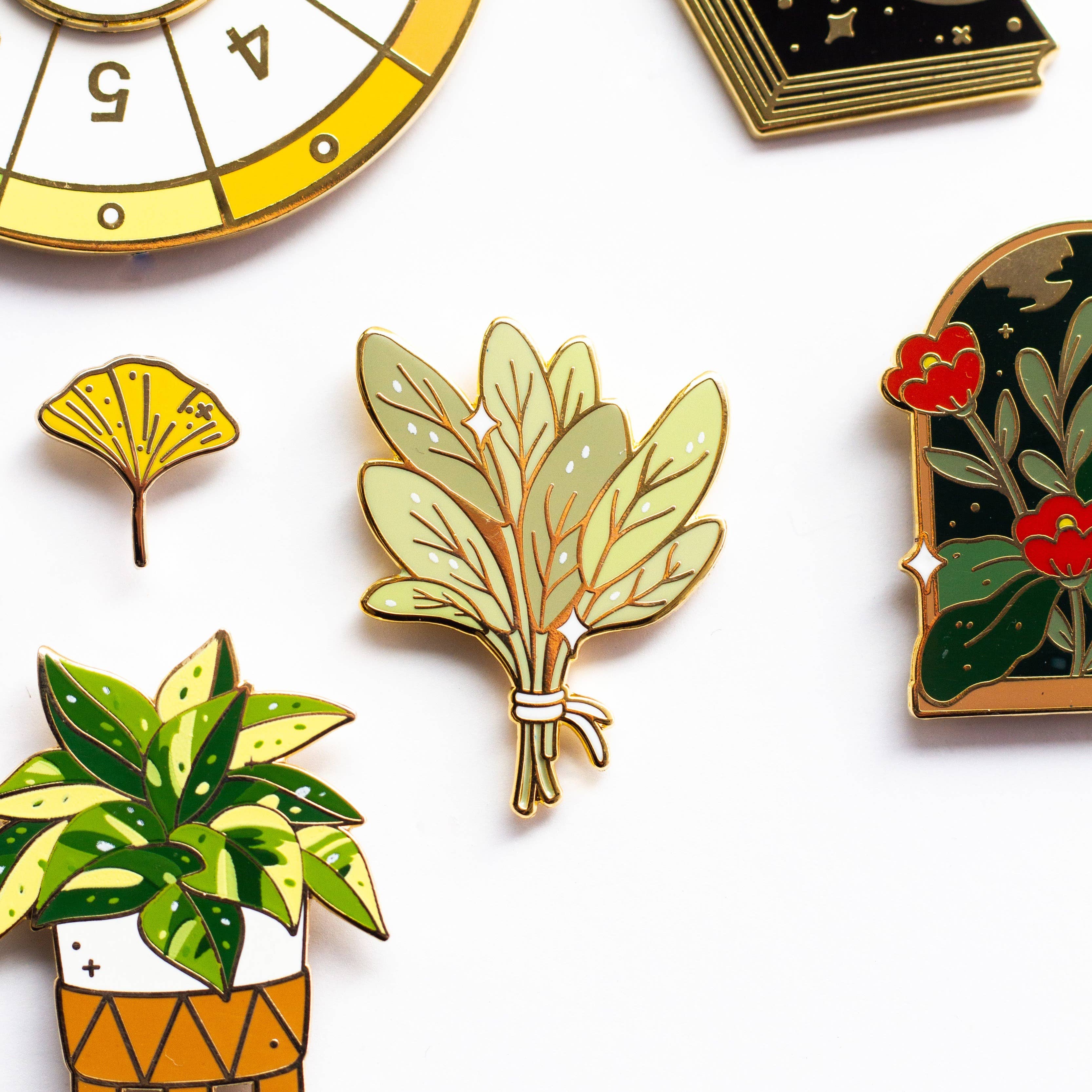 Bundle of Sage enamel pin featuring colorful plants, leaves, and small clock and card details.