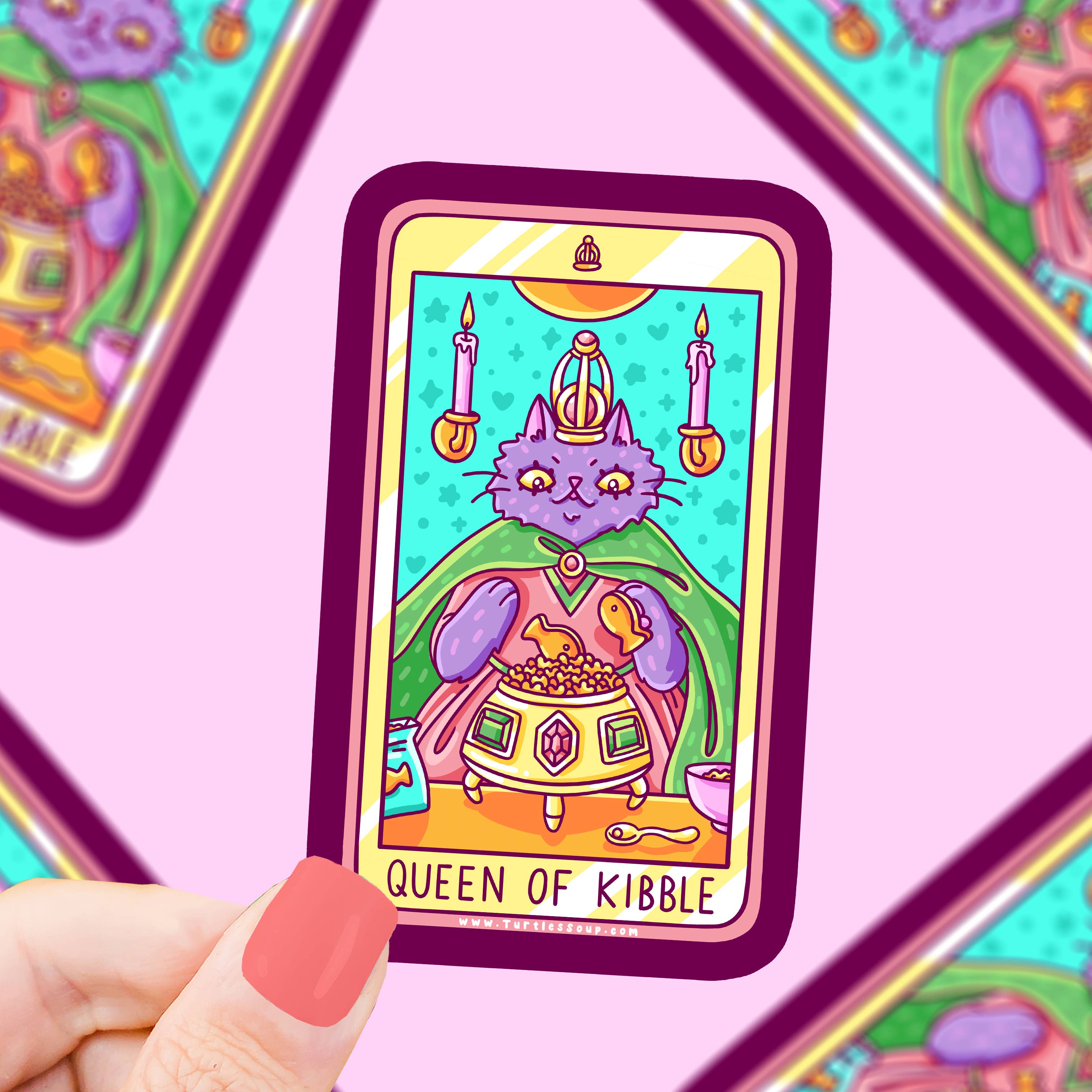 Queen of Kibble Cat Major Arcana Tarot Card vinyl sticker with a crowned purple cat and kibble, held in a hand.