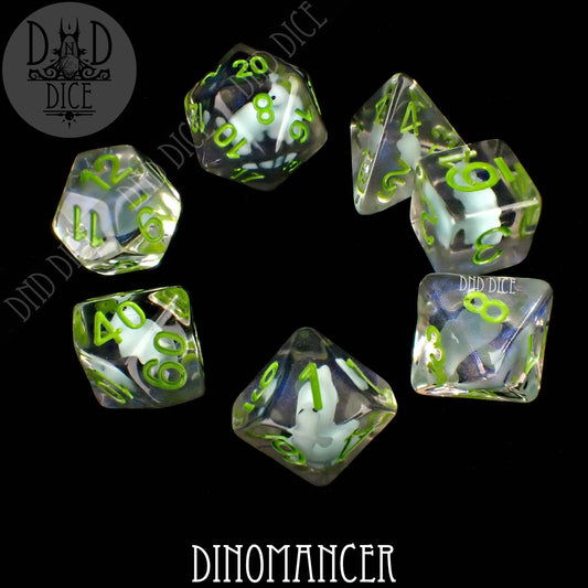 Dinomancer 7-piece transparent resin dice set with green numbers and a white dino inside.