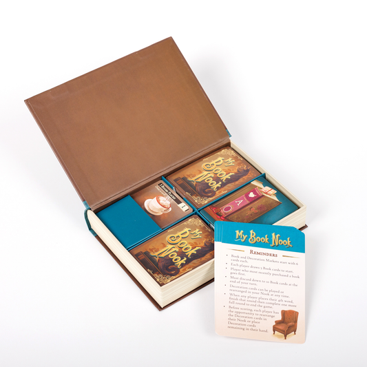 My Book Nook: A Cozy Word Building Game in a book-shaped box with cards, booklets, and instruction card.