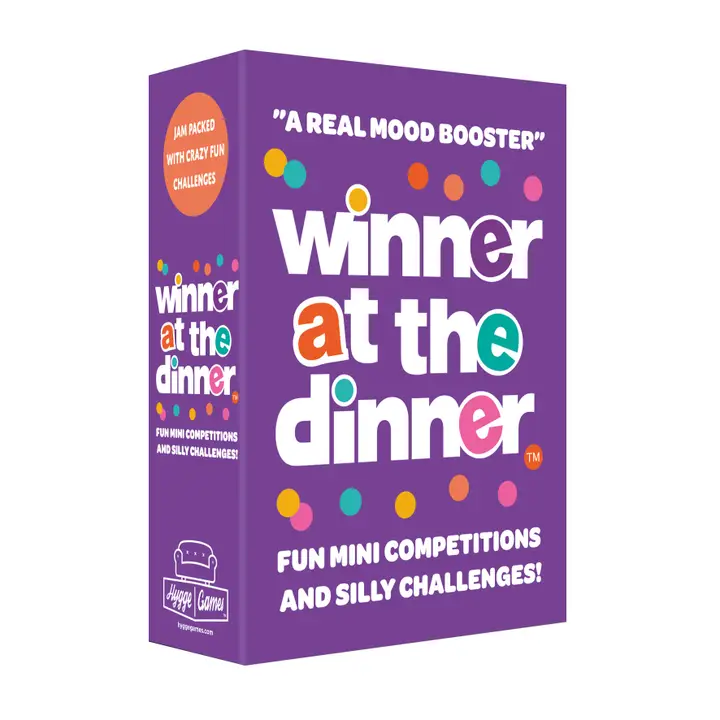 Purple game box labeled Winner at the Dinner family party game with colorful dots and mini competitions.