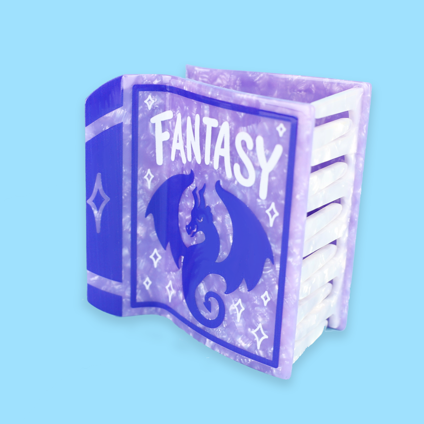Purple Fantasy Book box featuring a dragon, displaying the Fantasy hair claw accessory.