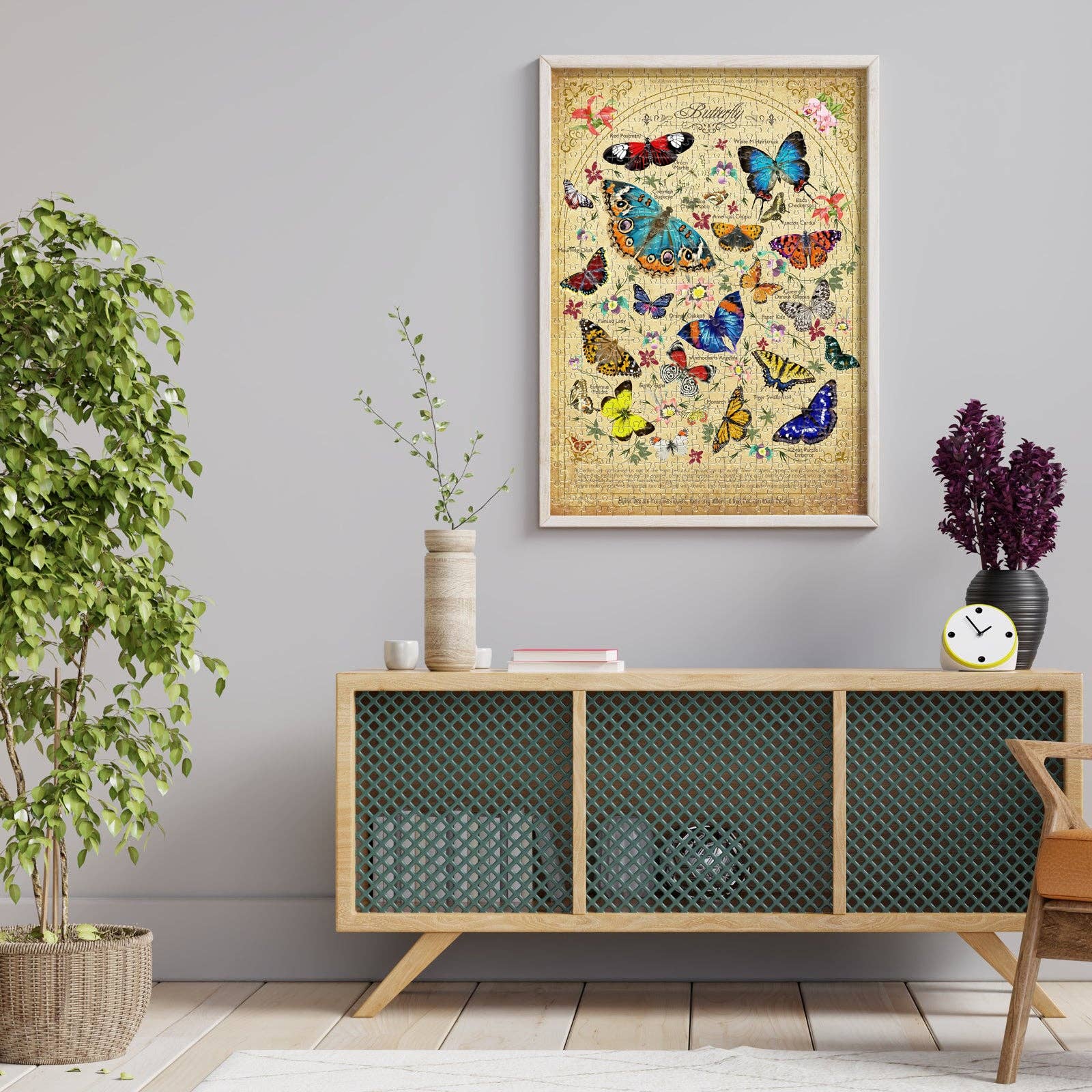 Eternal Butterflies 500 piece puzzle on sideboard in living room with butterfly art print, plant, and purple flowers.
