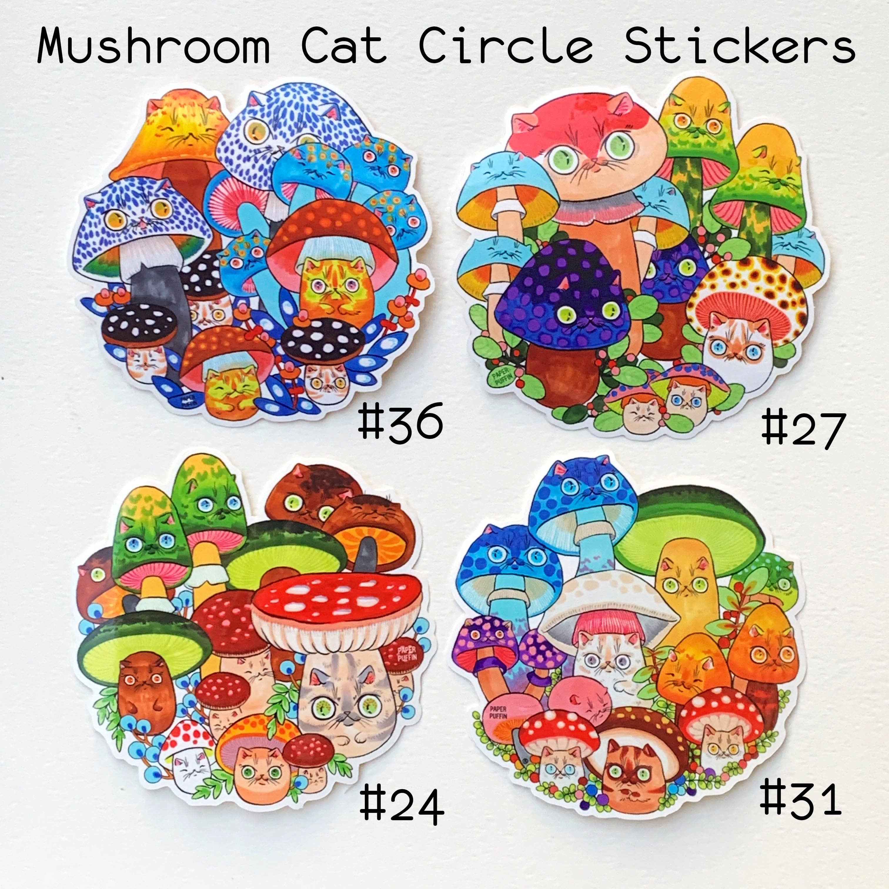 Four round vinyl mushroom cat stickers, labeled 36, 27, 24, and 31.