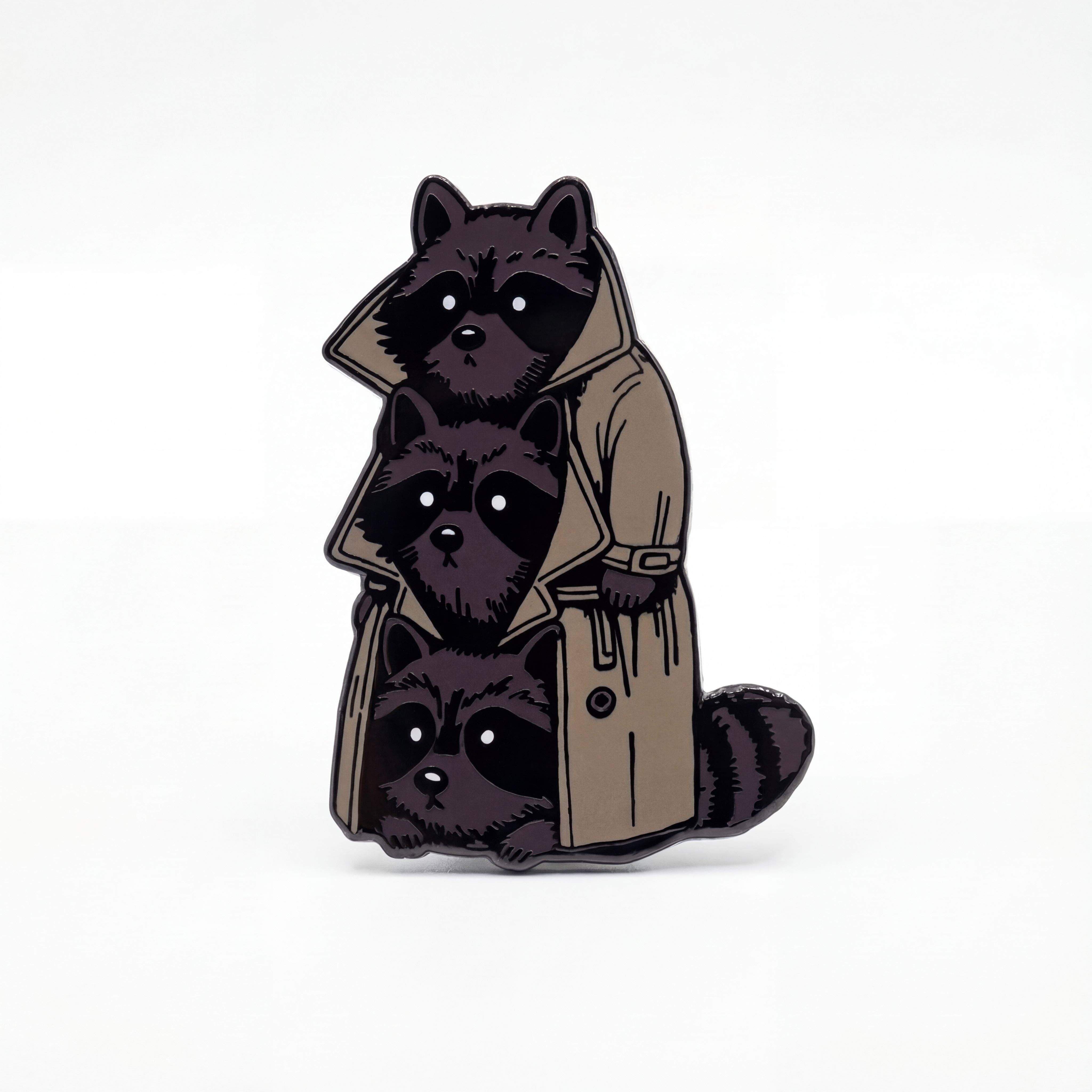 3 Raccoons In A Trenchcoat Pretending To Be A Guy hard enamel pin featuring three stacked raccoons and a clasp.