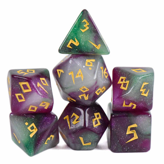 Acrylic DND dice set in translucent purple and green with gold numbers, stacked in a pyramid.