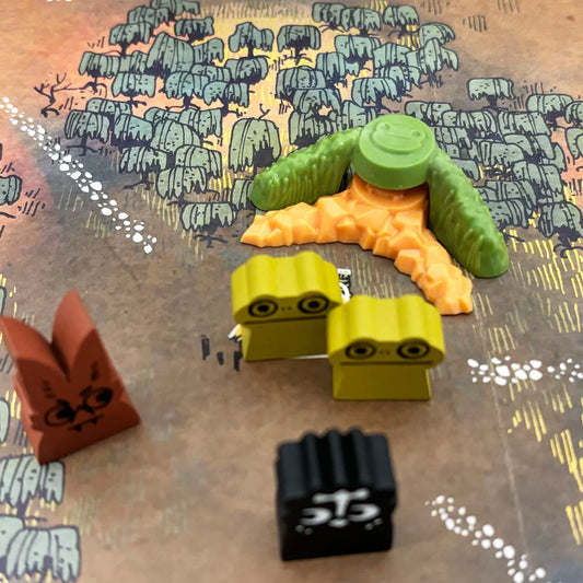 Deluxe Frog Clearing Markers for Root, shown with wooden animals and terrain tiles on a forest game board.