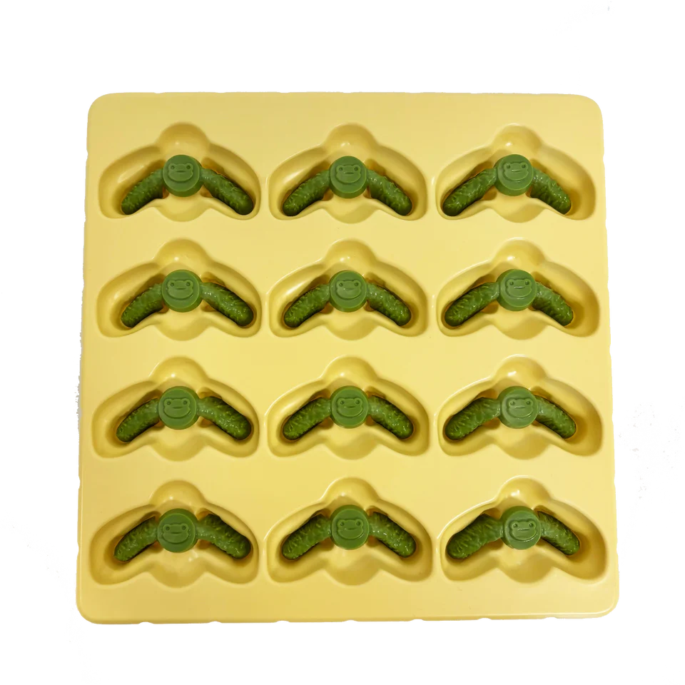 Yellow silicone mold with 12 smiling green frog shapes inspired by Root: Deluxe Frog Clearing Markers.
