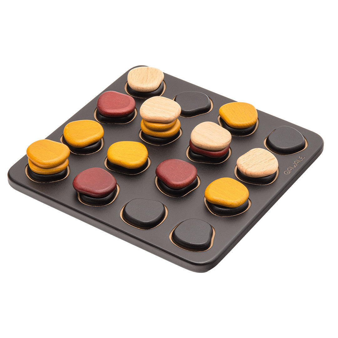 Qawale Mini abstract strategy game with yellow, brown, maroon, and black pieces on a black grid.
