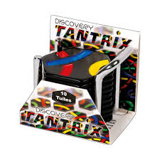 Tantrix Discovery game with stacked black tiles displaying colorful lines.
