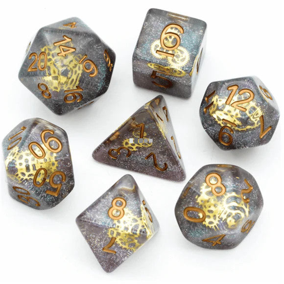 Glitter Gearwheel RPG Dice Set with seven translucent dice featuring gold numbers and foil.