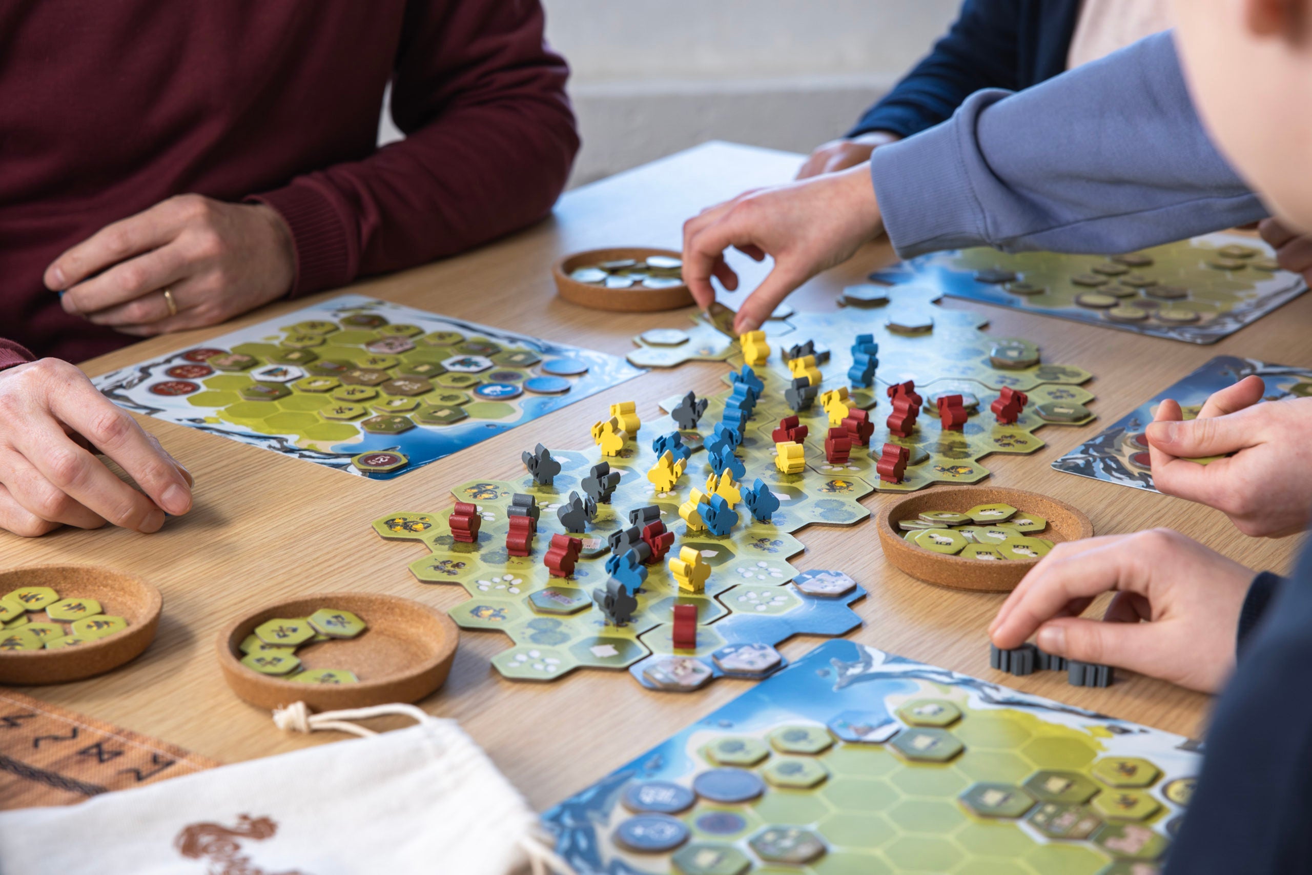 Looot Viking strategy board game with hex tiles and colorful pieces for four players, focused on resource management.