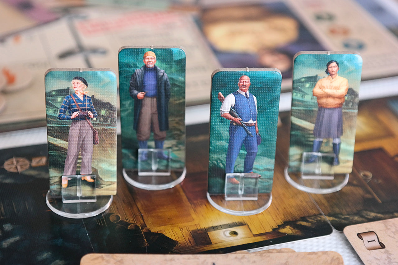 Four illustrated standees with Miskatonic Tales: Journey to Innsmouth board game components on game board.