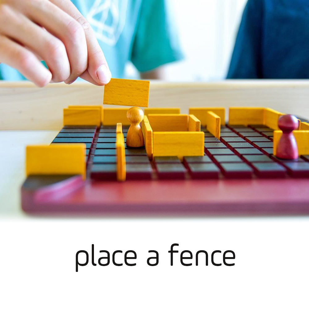 Quoridor board game with a hand placing a yellow fence, pawns, barriers, and on-screen text: place a fence.
