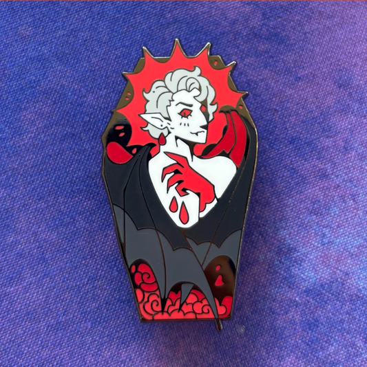 Coffin Pin featuring a gothic vampire with white hair, red eyes, and black cape.